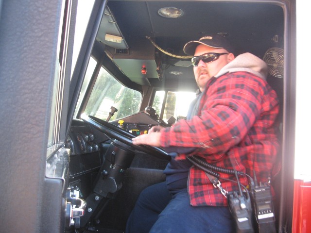 Firefighter Donald Slauch operating Engine 21-2.